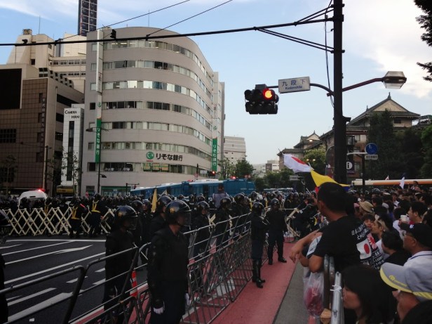 Here are the police everywhere, notice the riot buses blocking the route to the shrine